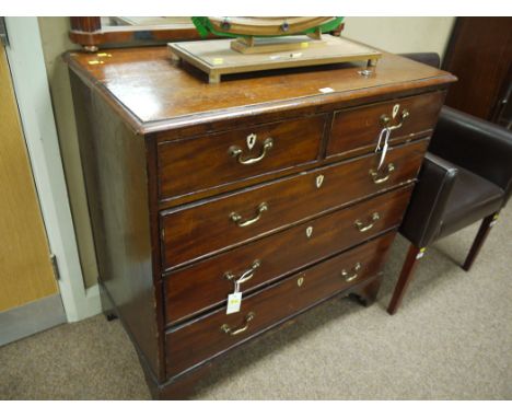 A 19th Century mahogany chest of drawers with moulded edge, fitted two short and three long graduating drawers with ivory col