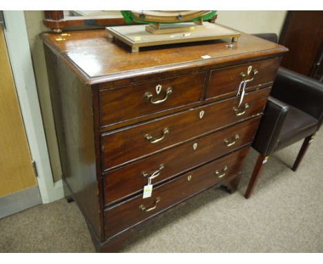 A 19th Century mahogany chest of drawers with moulded edge, fitted two short and three long graduating drawers with ivory col