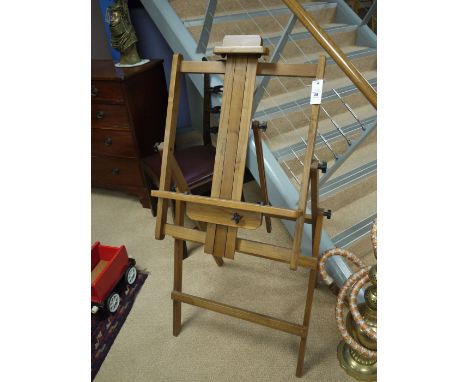 A modern hardwood folding easel.