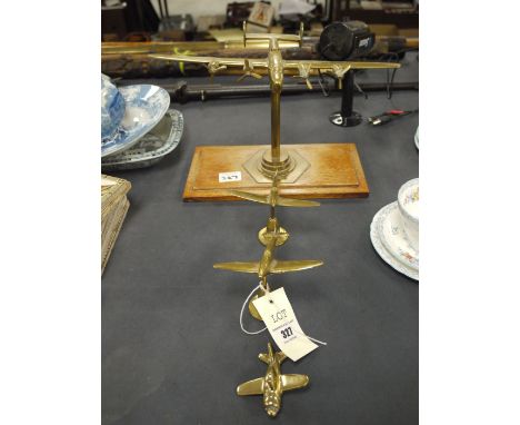 Four brass model Aeroplanes.