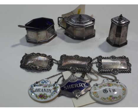 A three-piece silver condiment set of Art Deco design, Reid & Sons, Chester 1932, to include: a mustard pot, salt and peppere