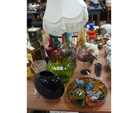 A collection of decorative glassware, including: two Murano clowns; glass vases; table lamp; paper weights; etc.