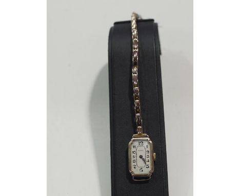 An Art Deco 9ct. yellow gold cased Rolex cocktail watch with arabic silvered dial and signed no. 3535685 to case reverse, on 