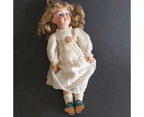 Max Handwerck bisque head doll, fixed blue eyes, painted open mouth and exposed teeth, composite jointed body, impressed mark