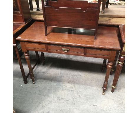 A mahogany aesthetic side table fitted single drawer, on turned and ring carved supports, and brass castors, 107cm wide