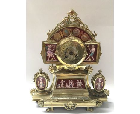 A mid 19th French century porcelain mounted gilt brass striking mantel clock,  the terracotta enamelled panels decorated with