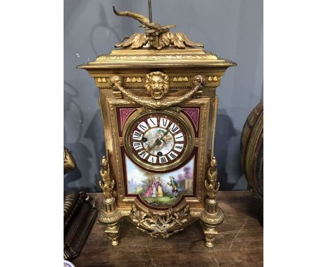 A gilt metal and painted porcelain bracket clock, in the French/Louis XVI style. the central panel painted with garden scene 