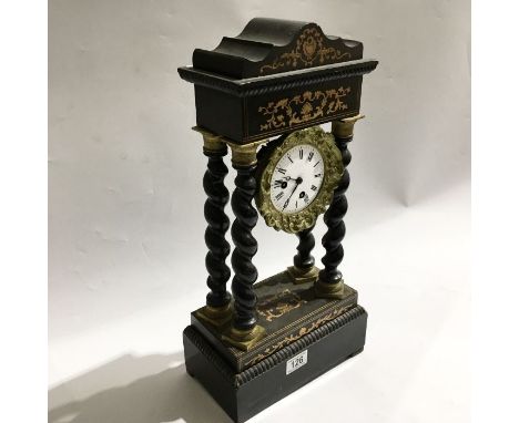 An ebonised and marquetry inlaid portico mantel clock, with twist carved columns on stepped block pediment, 48cm high