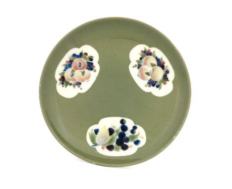 William Moorcroft, a Pomegranate and Blackberry Panel plate, circa 1914, on celadon ground, circular shallow dish form, impre