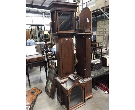 An oak longcase clock case and a mahogany crossbanded example (2) 