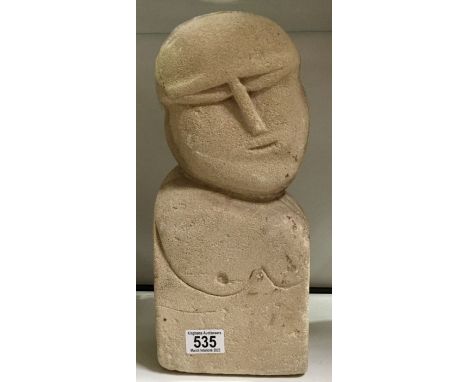 A carved limestone primitive bust portrait, 35.5cm high