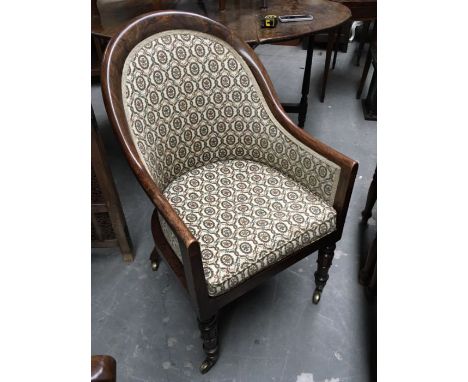 A William IIV mahogany faux rosewood tub chair, on petal carved and ring turned supports and brass caps and castors