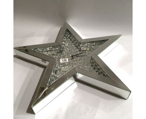 A Julien Macdonald encapsulated crystal mirrored star shape wall clock