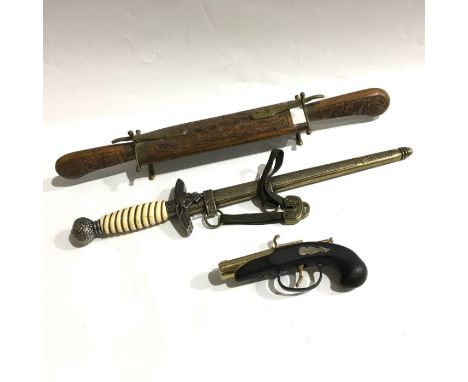 A replica German Luftwaffe officers dress dagger with scabbard and hangers, a brass flintlock pistol lighter PAT. 204961, and