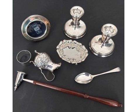 A collection of Elizabeth II silver, to include a circular picture frame by Broadway &amp; co, a pair of dwarf candlesticks, 