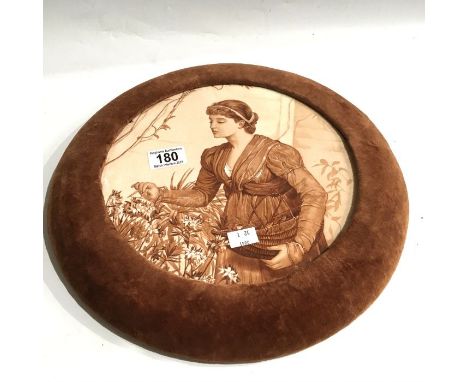 An Arts and Crafts circular plaque, painted with a portrait of a maiden flower picking, in a velvet lined frame, plaque 25cm 