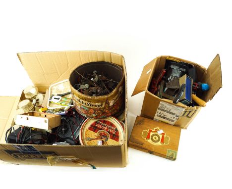 A collection of assorted remotes, modelling tools, paints, motors 