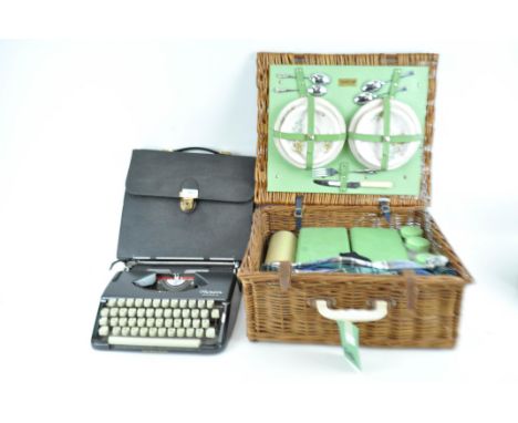A typewriter and a picnic hamper
