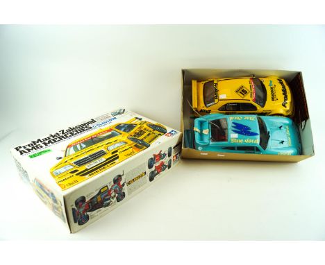 A boxed remote control 'Tamiya 58145' model kit with remote control and another car body