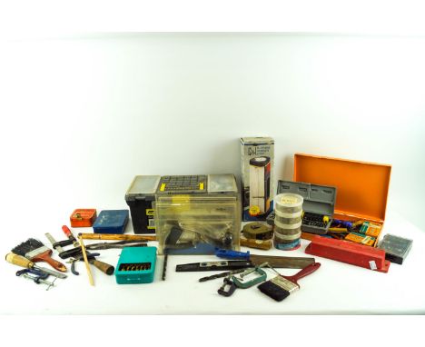 A collection of assorted tools, screws and other fixings