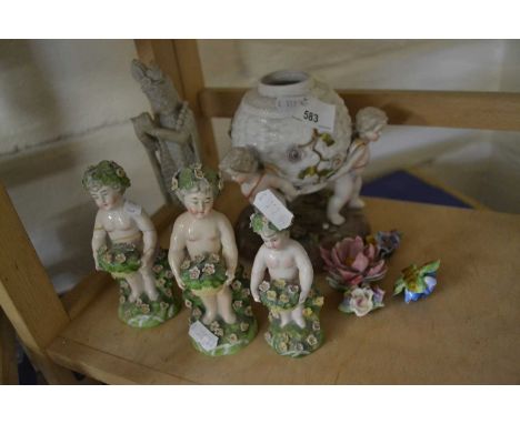 THREE FIGURES OF CHERUBS HOLDING BASKETS OF FLOWERS TOGETHER WITH ANOTHER FIGURE SIMILAR, AND A HARDSTONE CARVING (A/F)