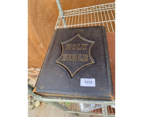 A VINTAGE LEATHER BOUND HOLY BIBLE 