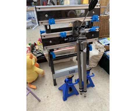 A MACALLISTER FOLDING WORK BENCH, A TRIPOD STAND AND TWO AXEL STANDS ETC 