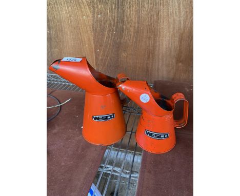 TWO VINTAGE GRADUATED WESCO OIL JUGS 