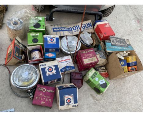 AN ASSORTMENT OF AUTOMOBILE SPARES TO INCLUDE FILTERS AND A HEAD LAMP ETC 