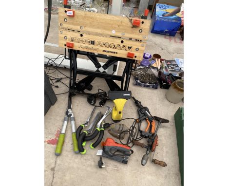 AN ASSORTMENT OF TOOLS TO INCLUDE A FOLDING WORK BENCH, A BRACE DRILL, PALM SANDER ETC 