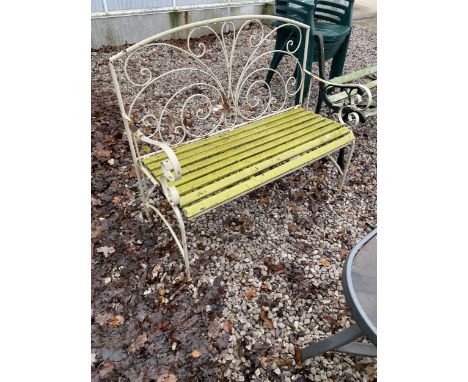 A METAL TWO SEATER GARDEN BENCH WITH WOODEN SLATS 