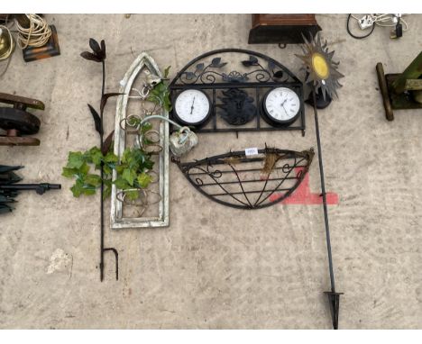 AN ASSORTMENT OF GARDEN ITEMS TO INCLUDE A SMALL HAYRACK, A WALL MOUNTED CLOCK AND THERMOMETER ETC 