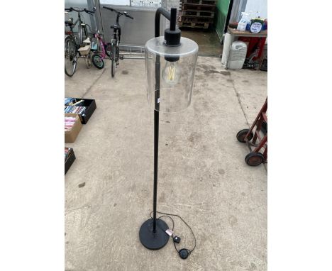A FLOOR STANDING LAMP WITH GLASS SHADE 