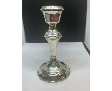 A HALLMARKED BIRMINGHAM SILVER CANDLESTICK GROSS WEIGHT 207.7 GRAMS WITH WEIGHTED BASE 
