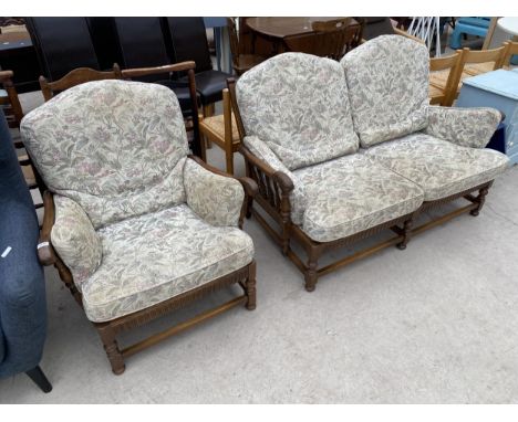 AN ERCOL OLD COLONIAL ELM TWO SEATER SETTEE WITH TURNED AND ARCHED BACK COMPLETE WITH MATCHING CHAIR 