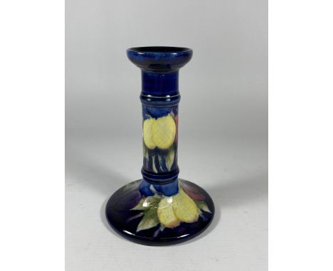 A MOORCROFT 'WISTERIA' BERRY PATTERN SHORT CANDLESTICK 