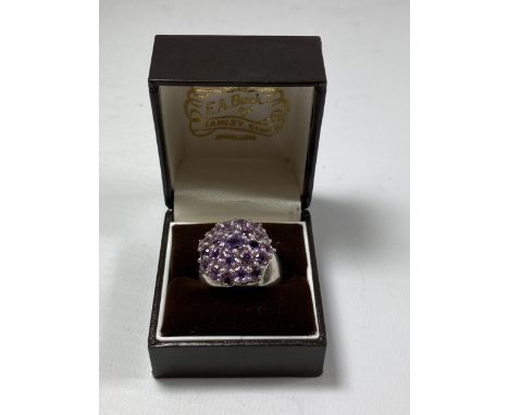 A BOXED LADIES SILVER DRESS RING 