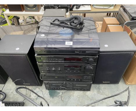 A TECHNICS STEREO SYSTEM WITH RECORD PLAYER, CD PLAYER, TUNER AND A PAIR OF SPEAKERS ETC 