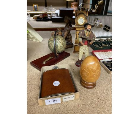 A GLOBE AND PEN HOLDER ON A WOODEN PLINTH, RESIN MODEL OF A LADY AND DONKEY, TREEN EGG, HIP FLASK, WOODEN COWBOY, ETC 