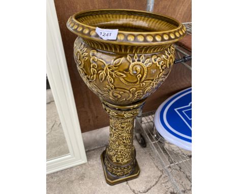 A CERAMIC WEST GERMENY JARDINAIRE AND STAND 