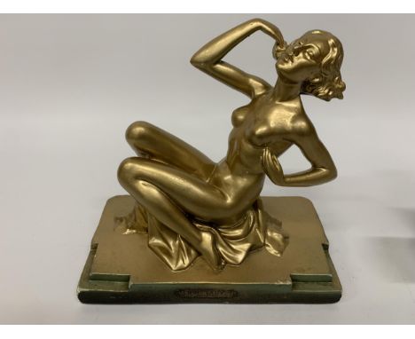 A METAL ART DECO STYLE GOLD COLOURED FIGURE 'RING LADY' HEIGHT 23CM, LENGTH 24CM 