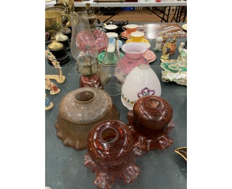 TWO VINTAGE OIL LAMPS WITH HANDPAINTED GLASS PLUS SIX GLASS SHADES 