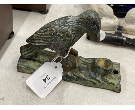 A CAST METAL WOODPECKER DOOR KNOCKER MODEL 