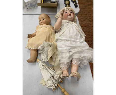 TWO VINTAGE DOLLS, ONE LARGE WITH A CERAMIC HEAD MARKED GERMANY, THE OTHER MARKED 'ROSEBUD' 
