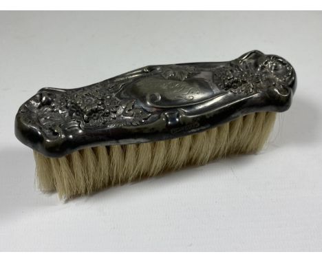 A STERLING SILVER BACKED HAIRBRUSH 