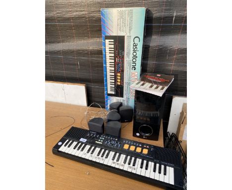 A CASIO CASIOTONE MT-220 KEYBOARD AND A LG SPEAKER SYSTEM 