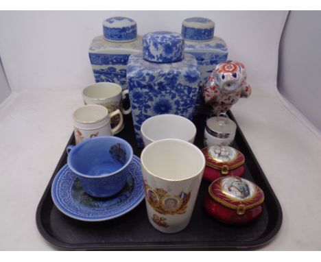 A tray containing assorted ceramics including Ringtons and Ironstone lidded caddies, Limoges lidded trinket pots, commemorati