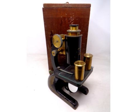 A vintage black lacquered and brass microscope by R&amp;B Ltd of Leeds, in case.