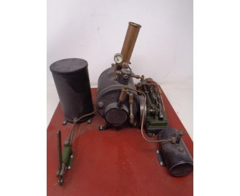 A Stuart Models live steam engine mounted on a wooden board.