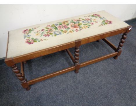 A barley twist duet footstool with tapestry seat.